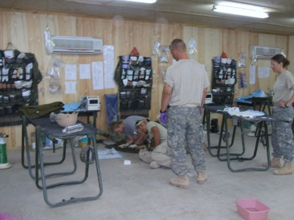 Sedating and operating on a South African Bomb Dog in FOB Hammer, Iraq.  The dog was injured and all flights were grounded, so Terri had to rely on radio guidance from the veterenarians in Baghdad.